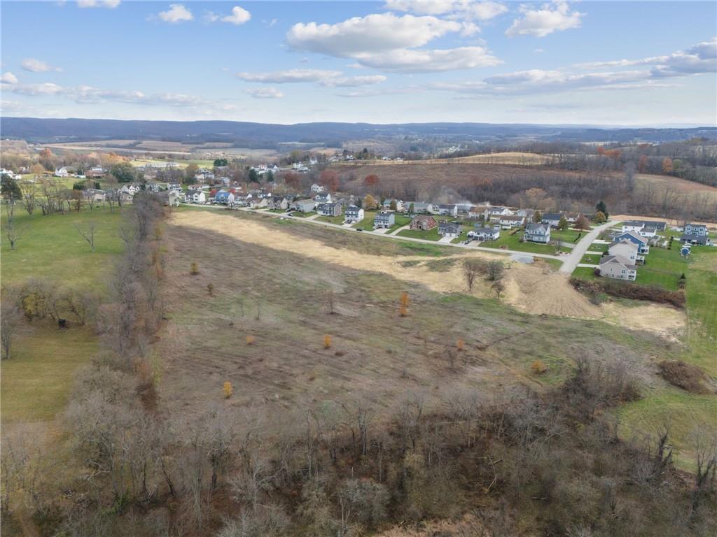 148 Sharon Drive Pleasant Unity, PA 15676 - Photo 5 of 5 a view of a lake with a city