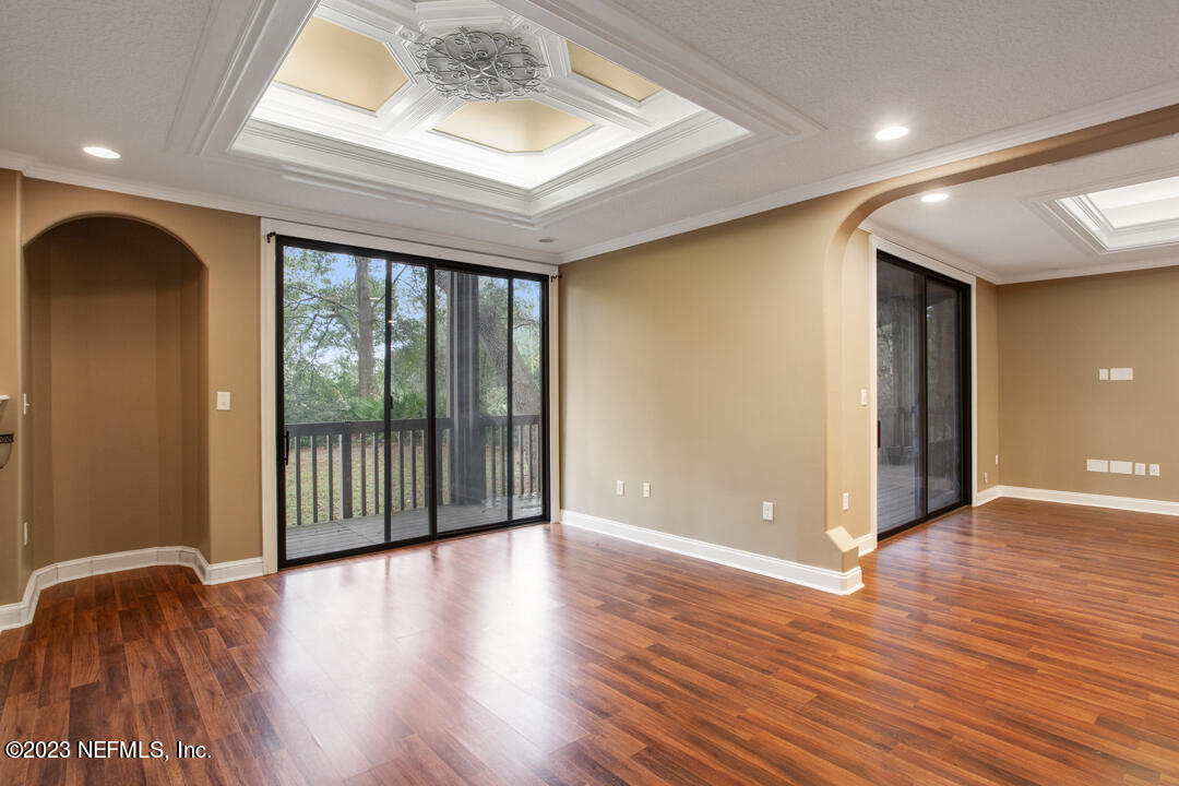 3165 Ravines Road, Unit 3604 Middleburg, FL 32068 - Photo 1 of 16 a view of an empty room with wooden floor and a window
