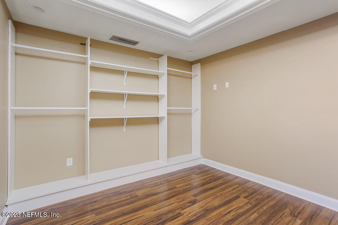 3165 Ravines Road, Unit 3604 Middleburg, FL 32068 - Photo 11 of 16 a view of a room with wooden floor and closet