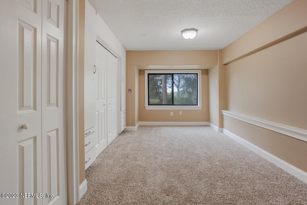 3165 Ravines Road, Unit 3604 Middleburg, FL 32068 - Photo 12 of 16 an empty room with windows and closet