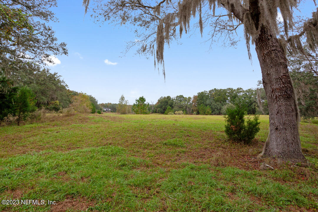3165 Ravines Road, Unit 3604 Middleburg, FL 32068 - Photo 16 of 16 a view of a lake with houses in the back