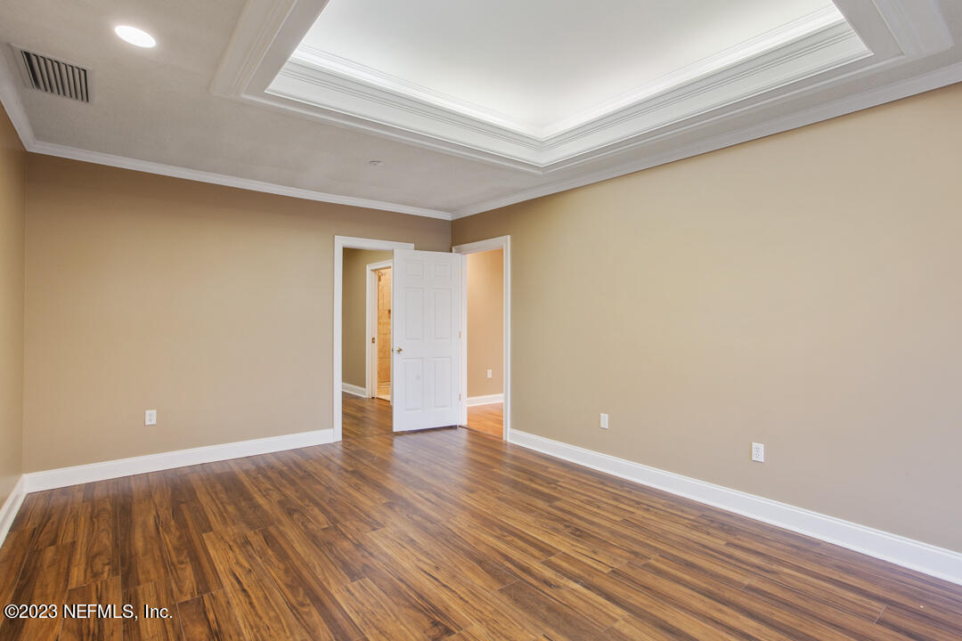 3165 Ravines Road, Unit 3604 Middleburg, FL 32068 - Photo 9 of 16 a view of an empty room with wooden floor