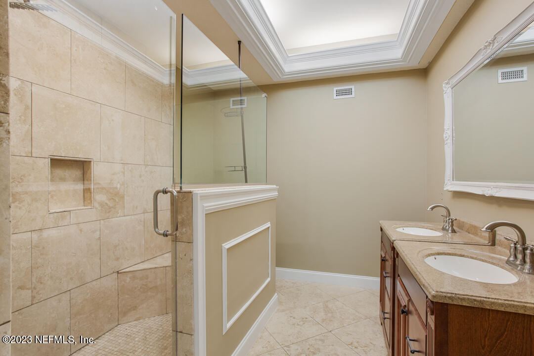 3165 Ravines Road, Unit 3604 Middleburg, FL 32068 - Photo 10 of 16 a bathroom with a sink and mirror