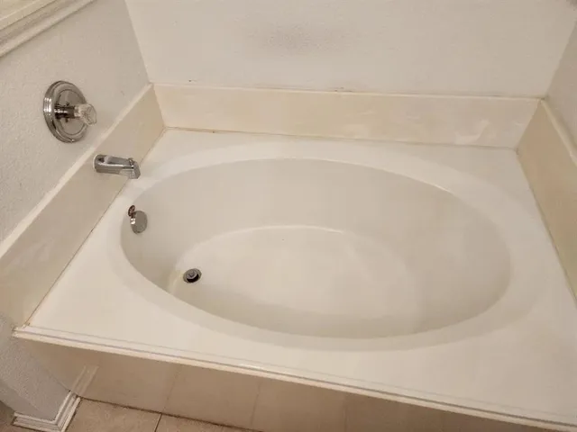 a bathroom with a white bath tub