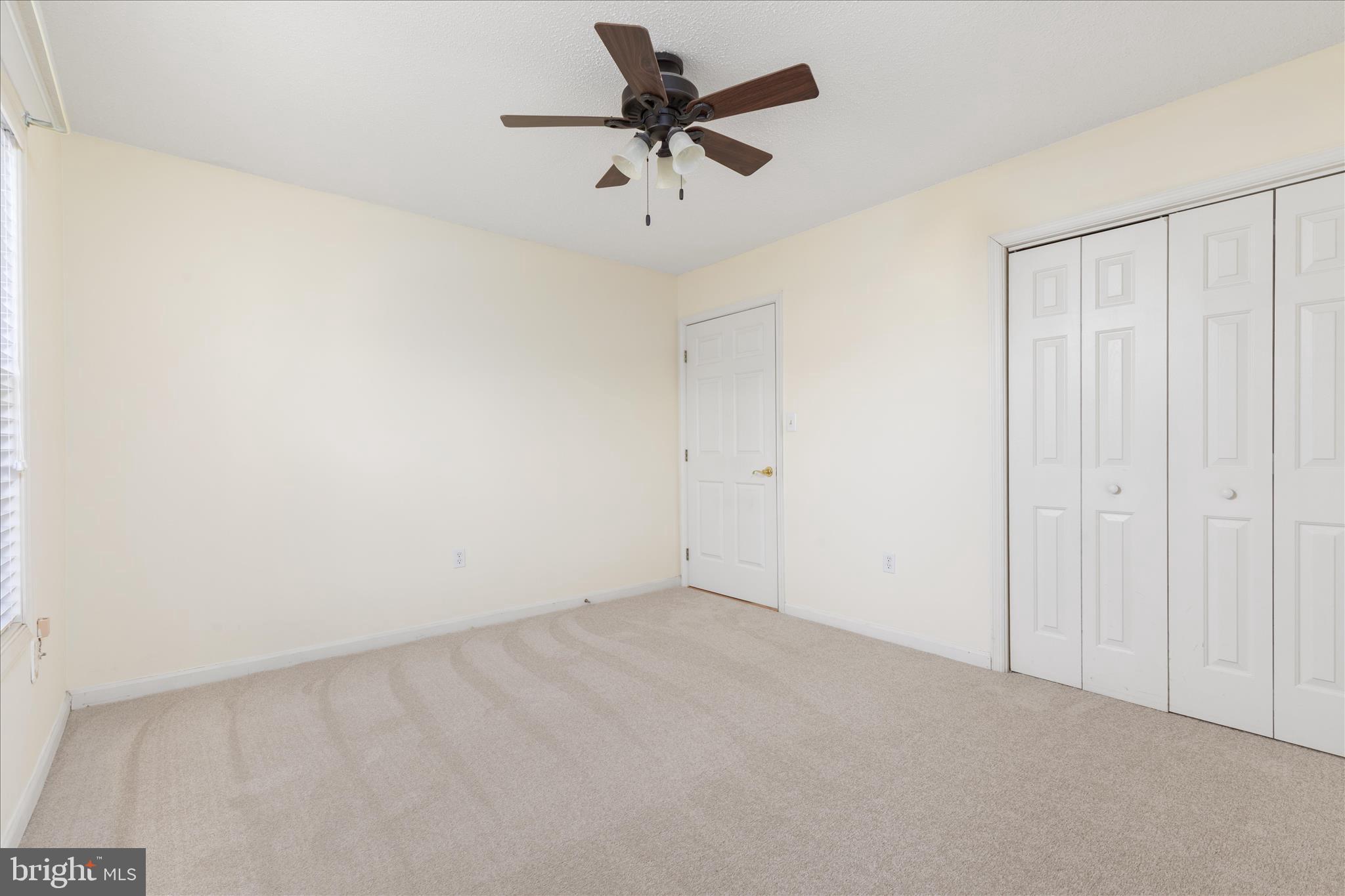 776 Ripplebrook Drive Culpeper, VA 22701 - Photo 21 of 30 an empty room with a ceiling fan and a window