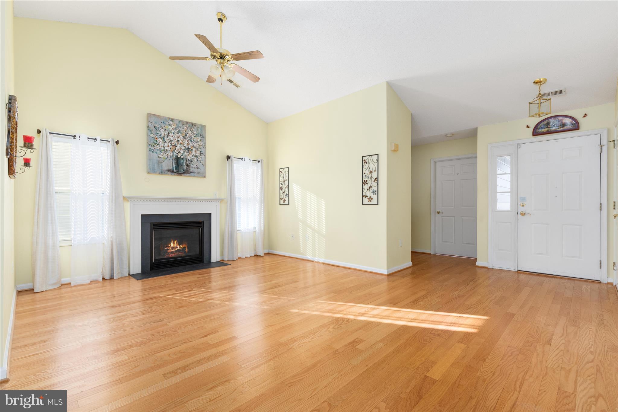 776 Ripplebrook Drive Culpeper, VA 22701 - Photo 5 of 30 a view of a livingroom with a fireplace and a ceiling fan