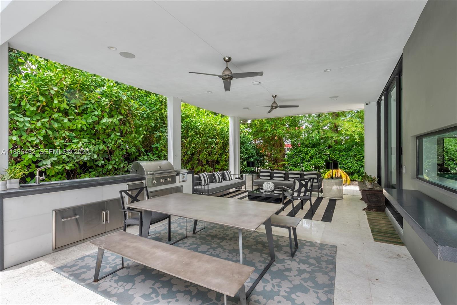 4675 Northeast 2nd Avenue Miami, FL 33137 - Photo 37 of 44 a outdoor space with chairs a couch and a potted plant