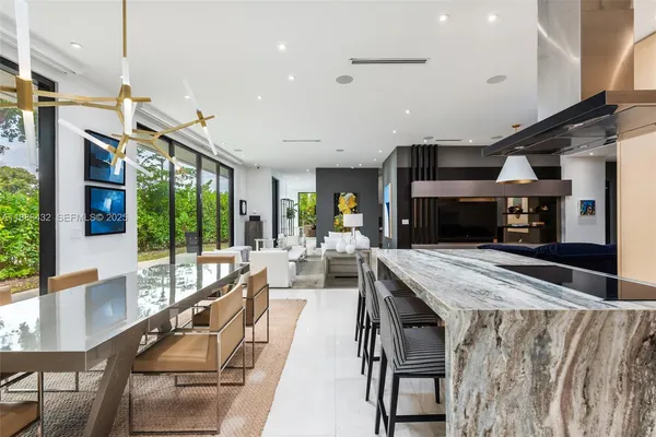 a view of a living room and kitchen