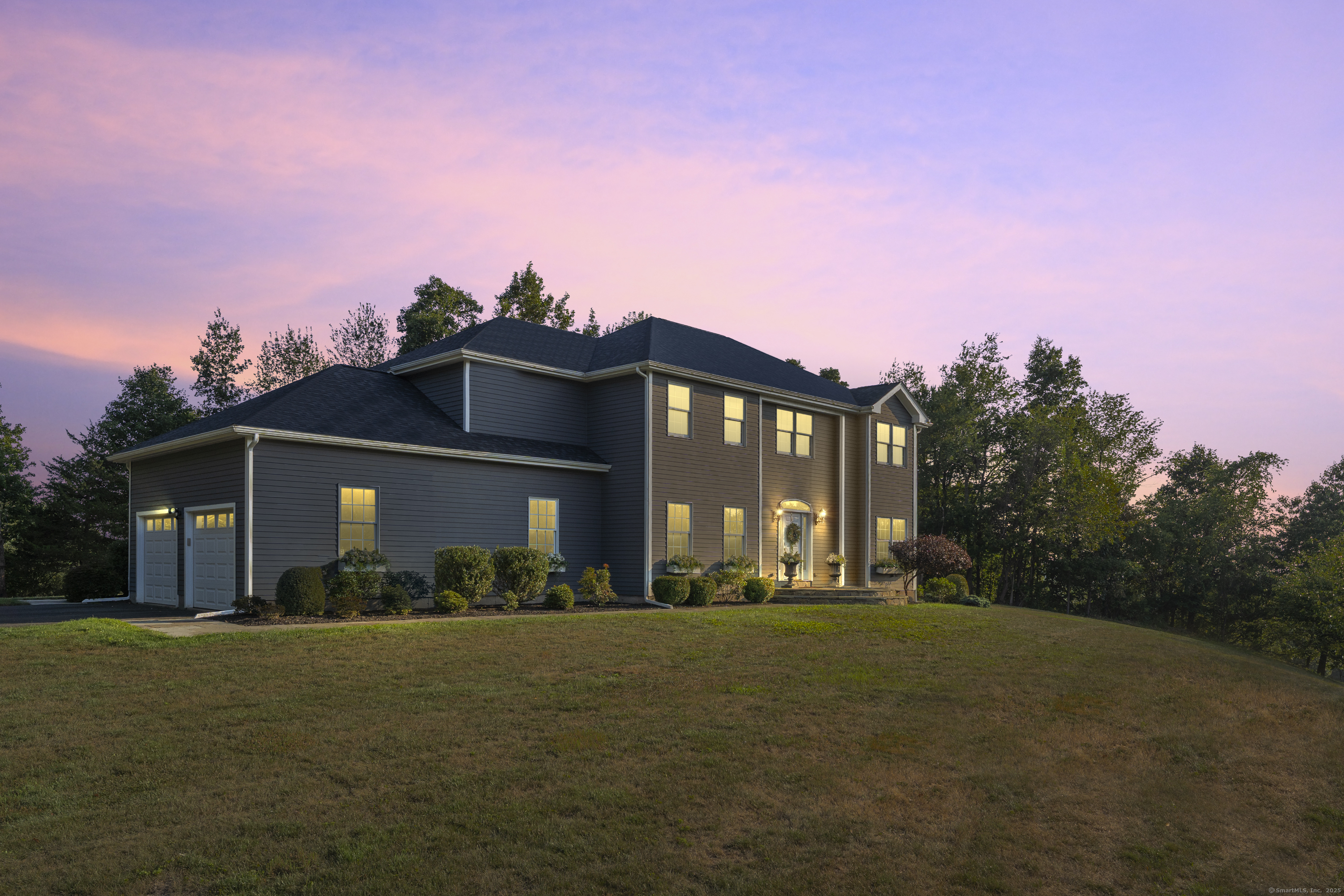 a front view of a house with a yard