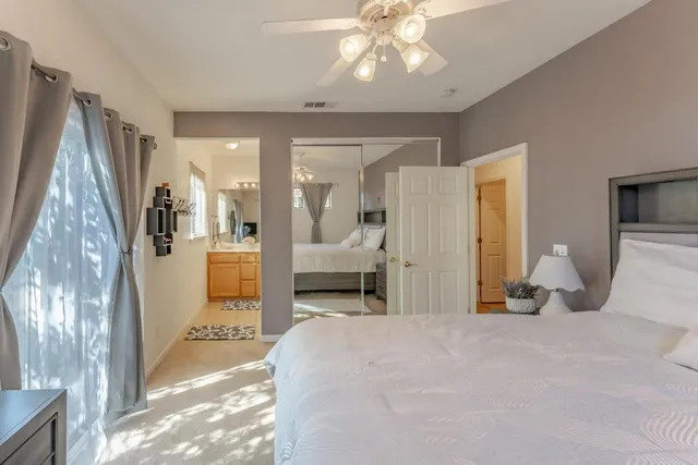 a bathroom with a toilet a sink and shower