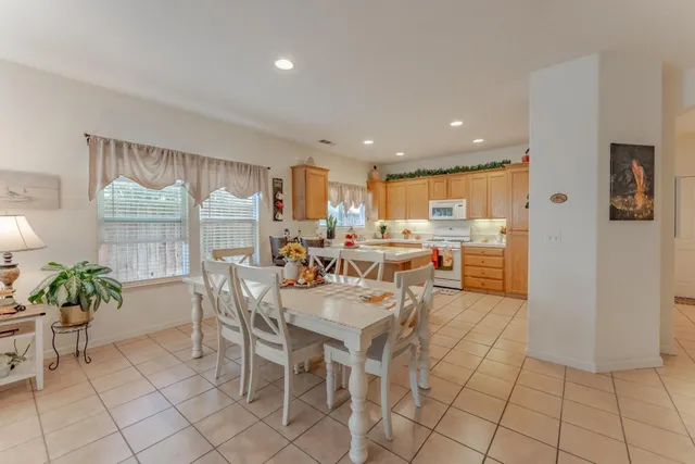 a kitchen with appliances a sink and cabinets