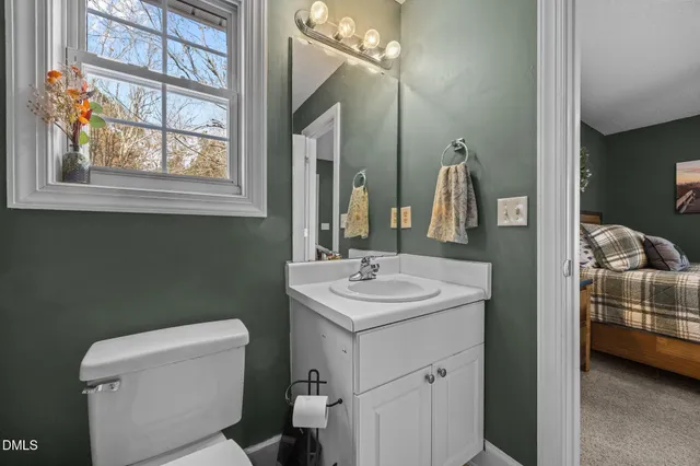 a en suite bathroom with a sink and a mirror