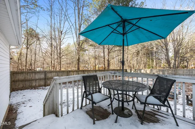 a view of a chairs and table in the patio