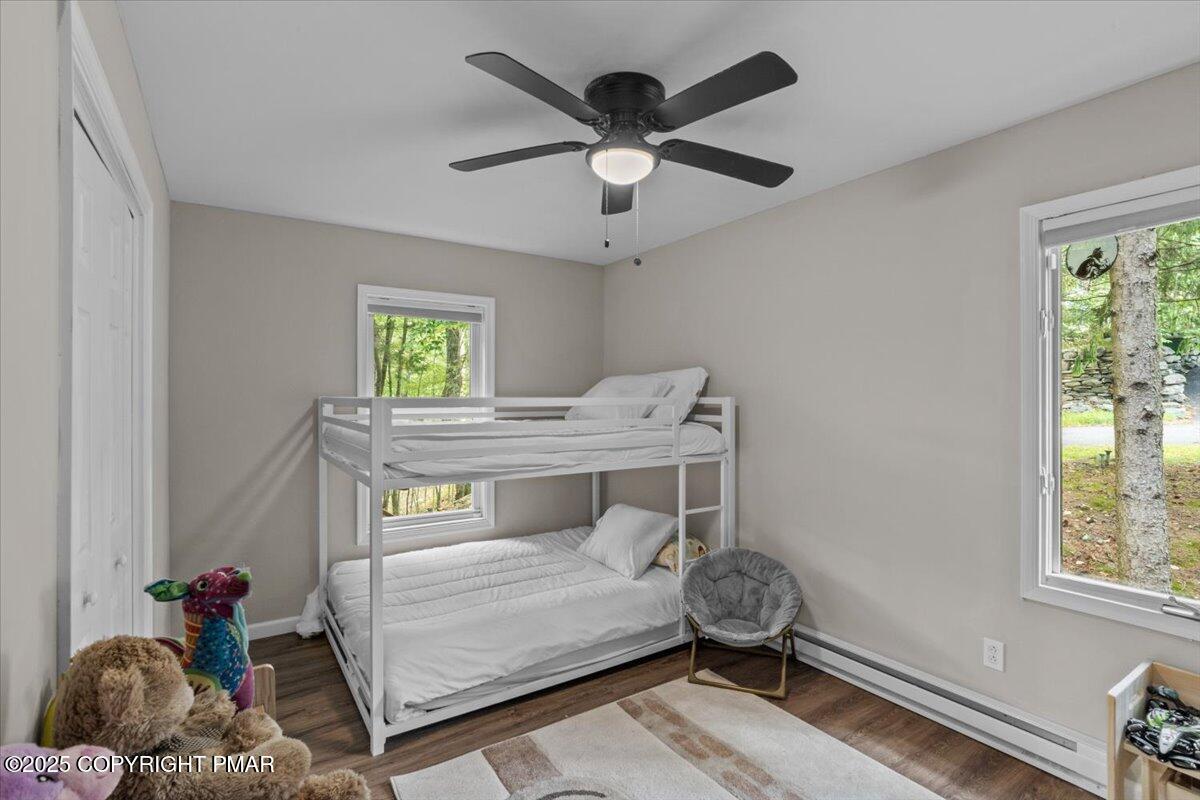 415 Canterbury Road Bushkill, PA 18324 - Photo 15 of 36 a bedroom with a bed and a window