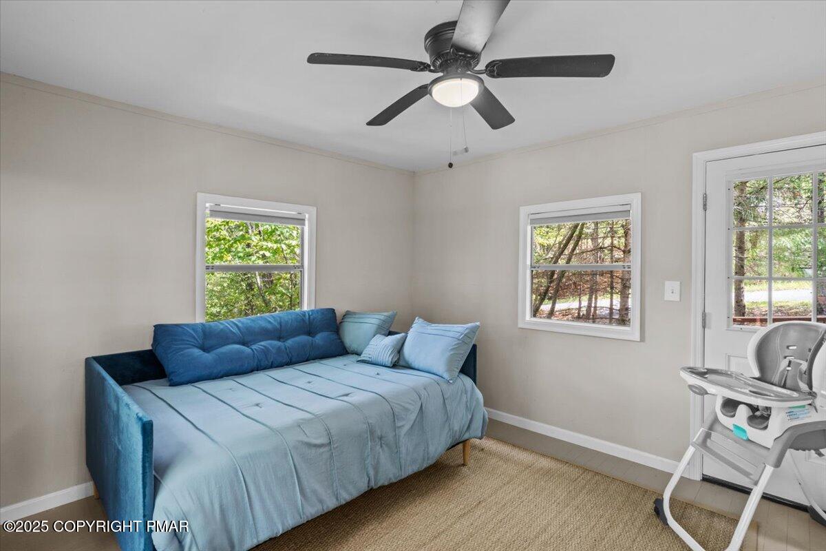 415 Canterbury Road Bushkill, PA 18324 - Photo 17 of 36 a bedroom with a bed and a window