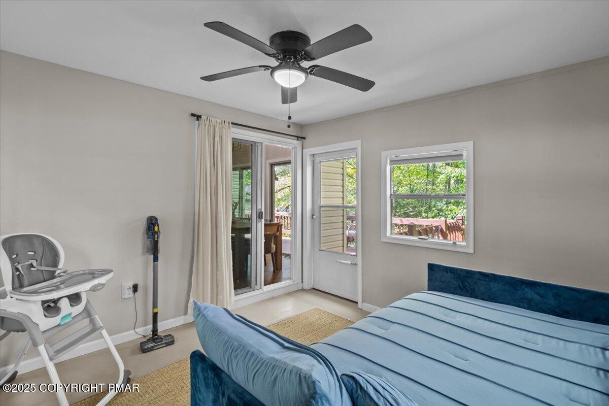 415 Canterbury Road Bushkill, PA 18324 - Photo 18 of 36 a bedroom with a bed and a window