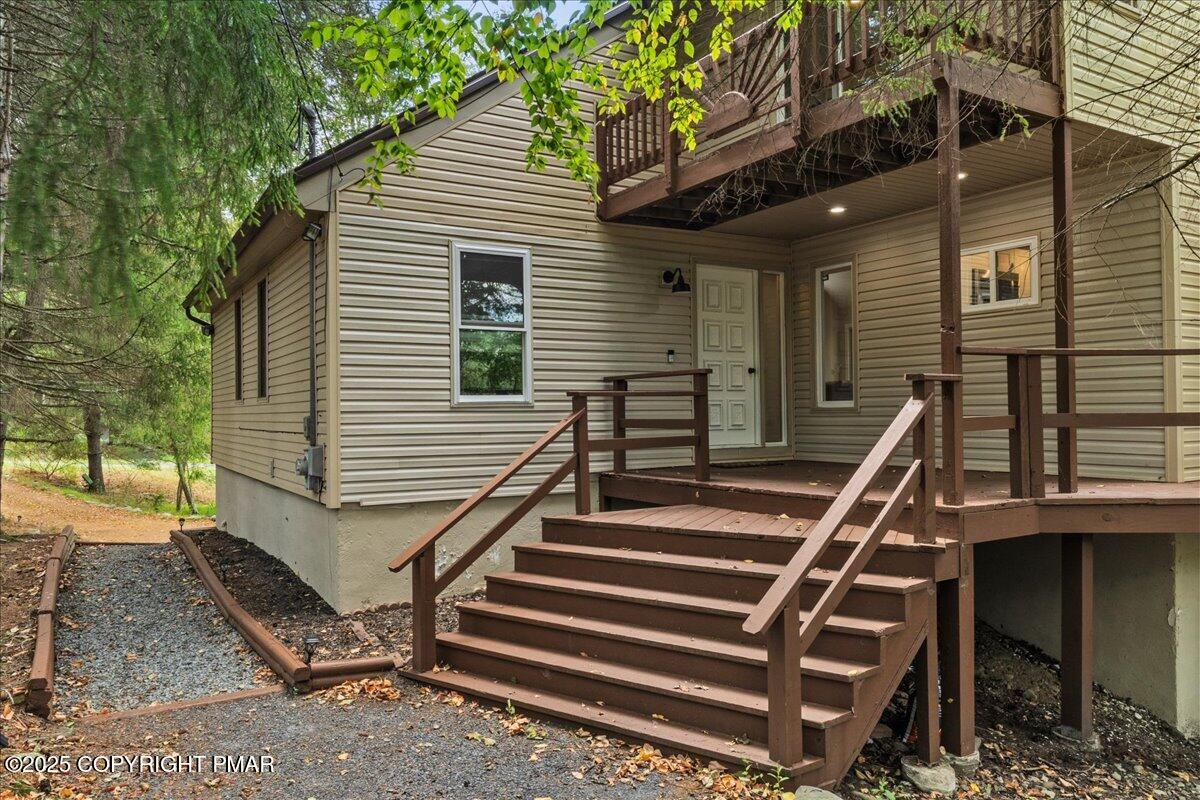 415 Canterbury Road Bushkill, PA 18324 - Photo 2 of 36 a front view of a house with stairs