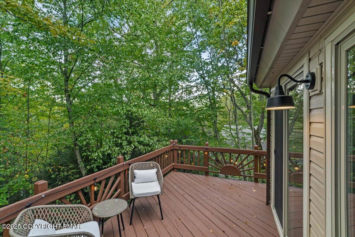 415 Canterbury Road Bushkill, PA 18324 - Photo 32 of 36 a view of balcony with wooden floor and fence