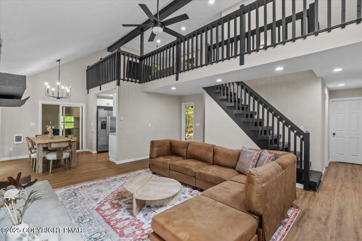 415 Canterbury Road Bushkill, PA 18324 - Photo 4 of 36 a living room with furniture or stairs and a wooden floor