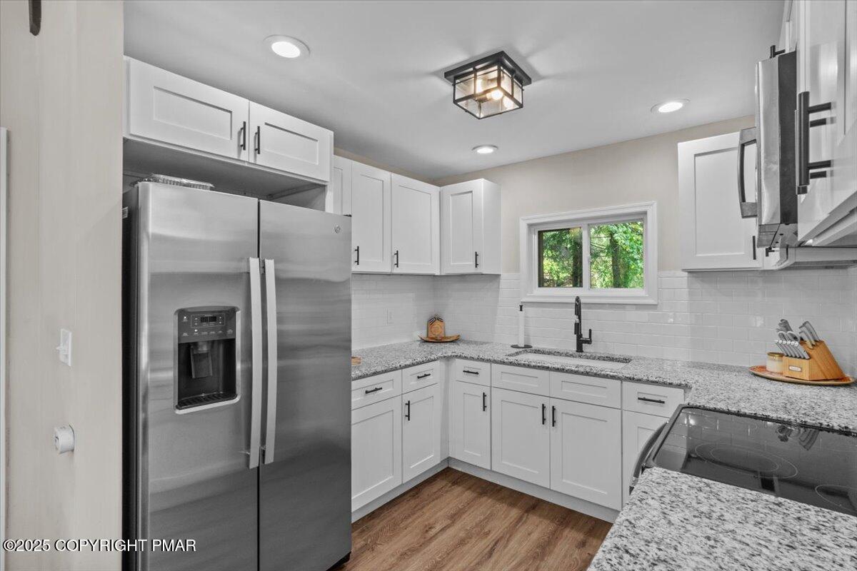 415 Canterbury Road Bushkill, PA 18324 - Photo 9 of 36 a kitchen with a sink appliances and cabinets