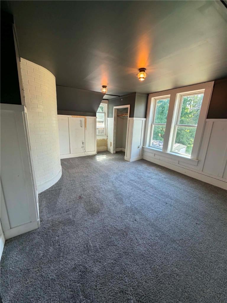 164 Sand Spring Road Cresco, PA 18326 - Photo 45 of 60 Ample windows illuminate this spacious room with plush carpeting and distinctive wall features.