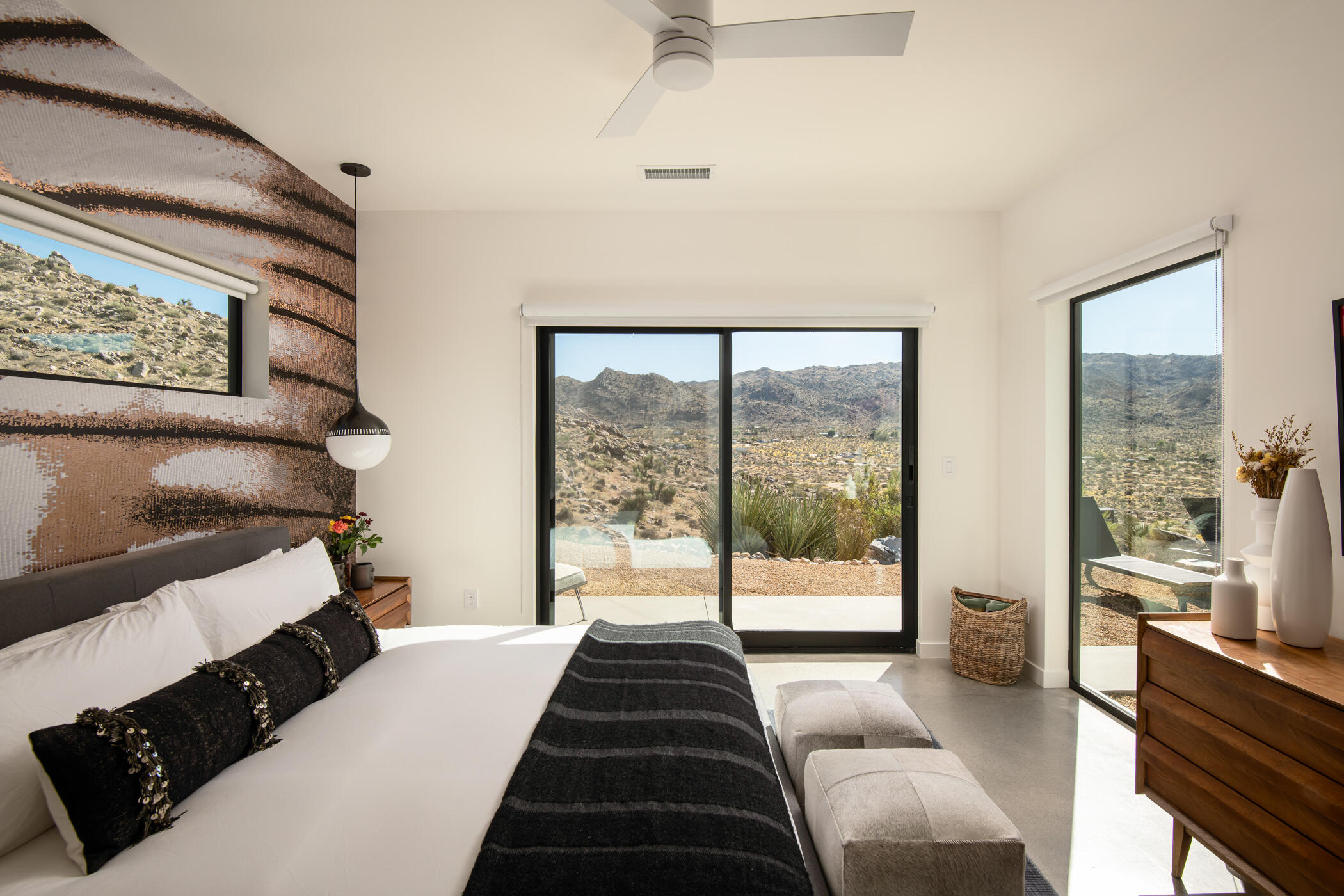 8520 Purple Sage Road Joshua Tree, CA 92252 - Photo 21 of 36 a bedroom with a bed and a large window
