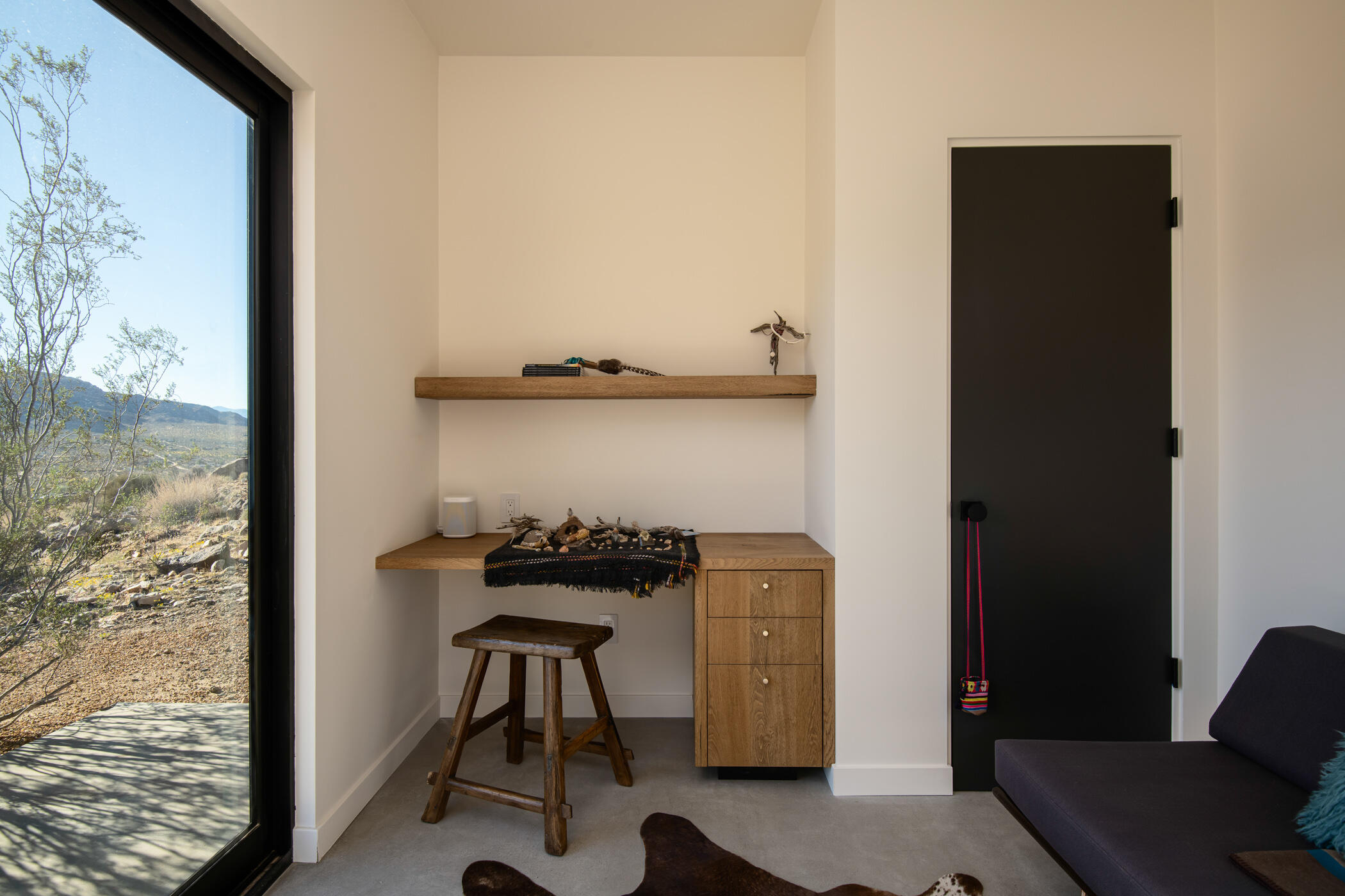 8520 Purple Sage Road Joshua Tree, CA 92252 - Photo 25 of 36 a view of a workspace with furniture and a window