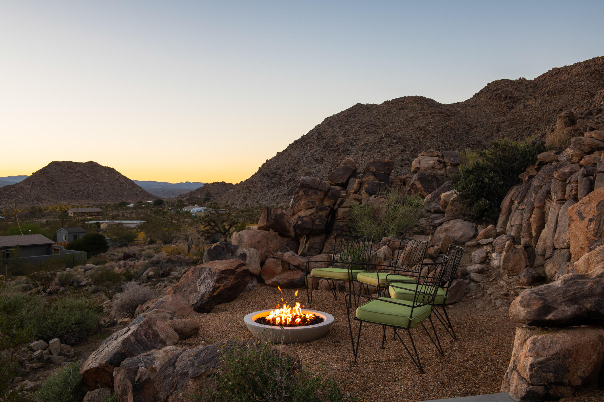 8520 Purple Sage Road Joshua Tree, CA 92252 - Photo 30 of 36 a view of a chairs and table in a backyard