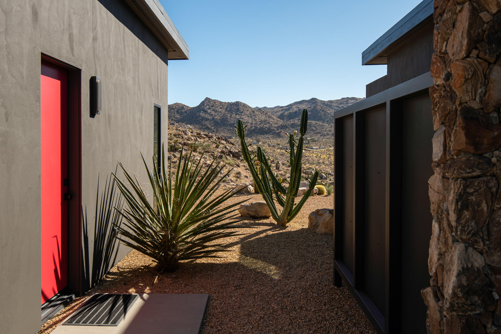 8520 Purple Sage Road Joshua Tree, CA 92252 - Photo 32 of 36 a view of a house with a door and wooden floor