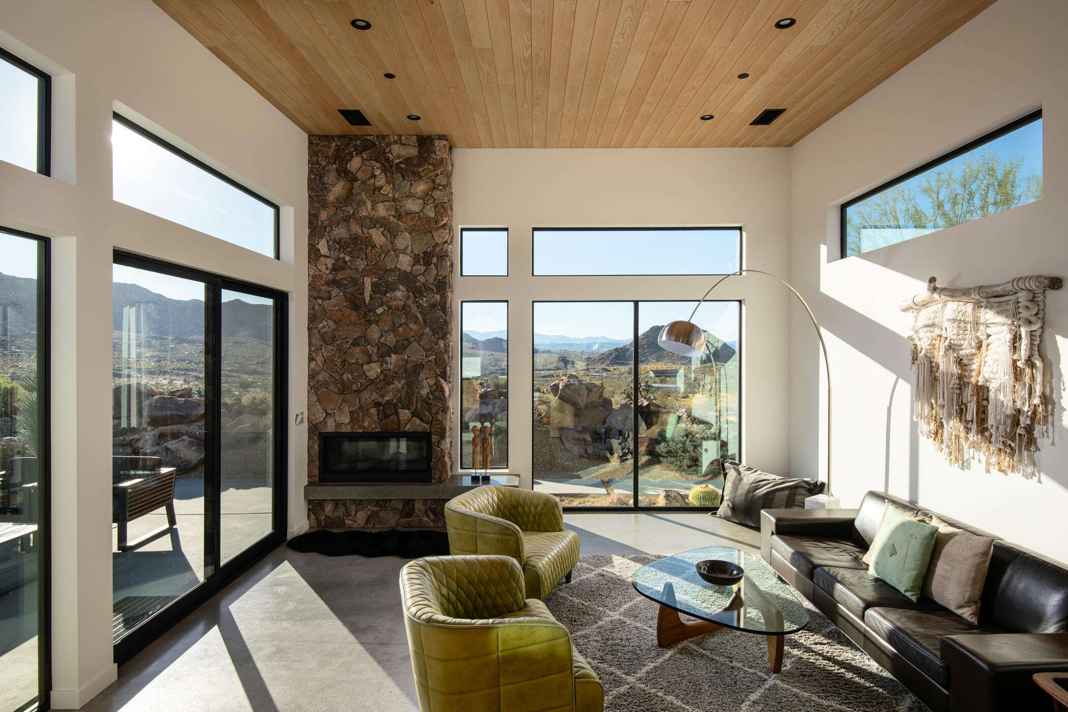 8520 Purple Sage Road Joshua Tree, CA 92252 - Photo 10 of 36 a living room with furniture and large windows