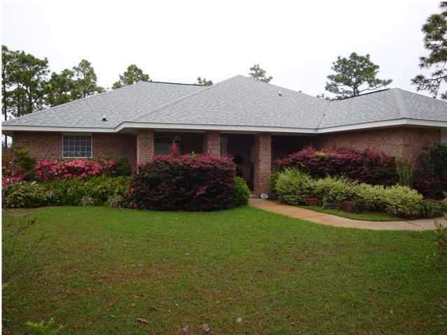 151 Buck Road Santa Rosa Beach, FL 32459 - Photo 1 of 16 a front view of house with garden