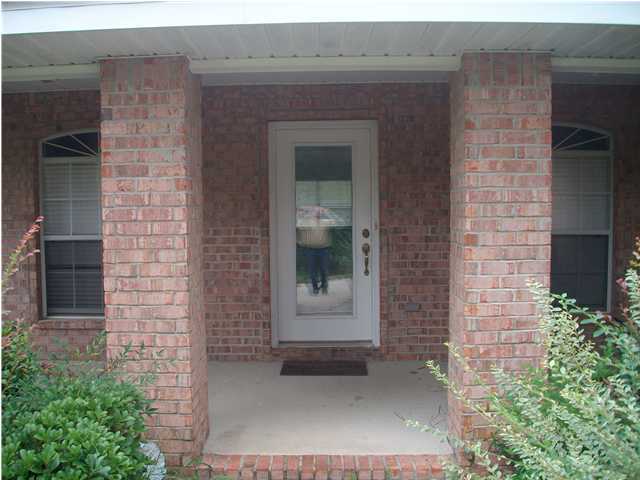 151 Buck Road Santa Rosa Beach, FL 32459 - Photo 12 of 16 a front view of a house with a entrance