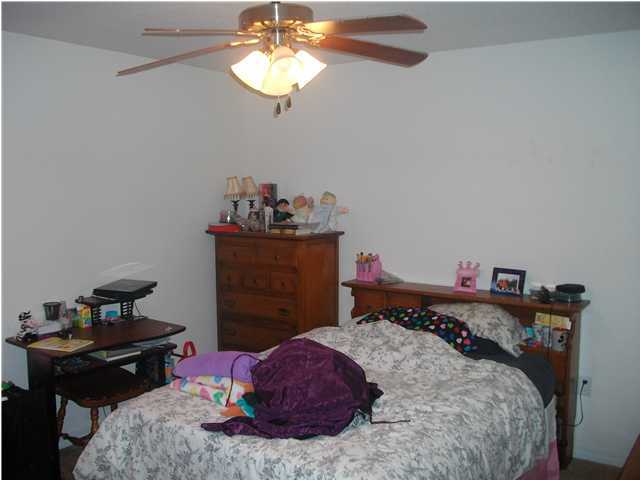 151 Buck Road Santa Rosa Beach, FL 32459 - Photo 15 of 16 a bedroom with a bed and dresser