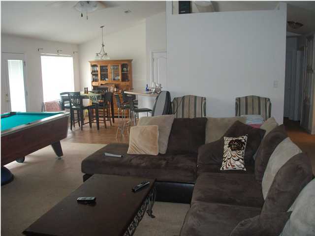 151 Buck Road Santa Rosa Beach, FL 32459 - Photo 6 of 16 a living room with furniture and a large window
