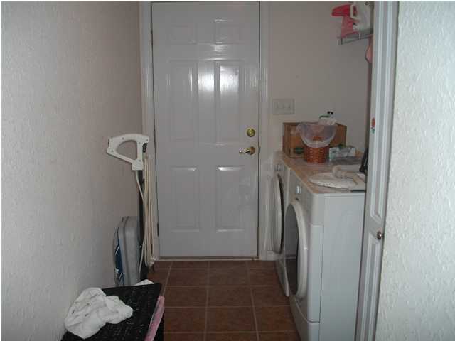 151 Buck Road Santa Rosa Beach, FL 32459 - Photo 8 of 16 a view of a storage & utility room with racks on the wall