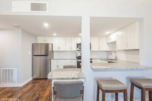a view of balcony with furniture