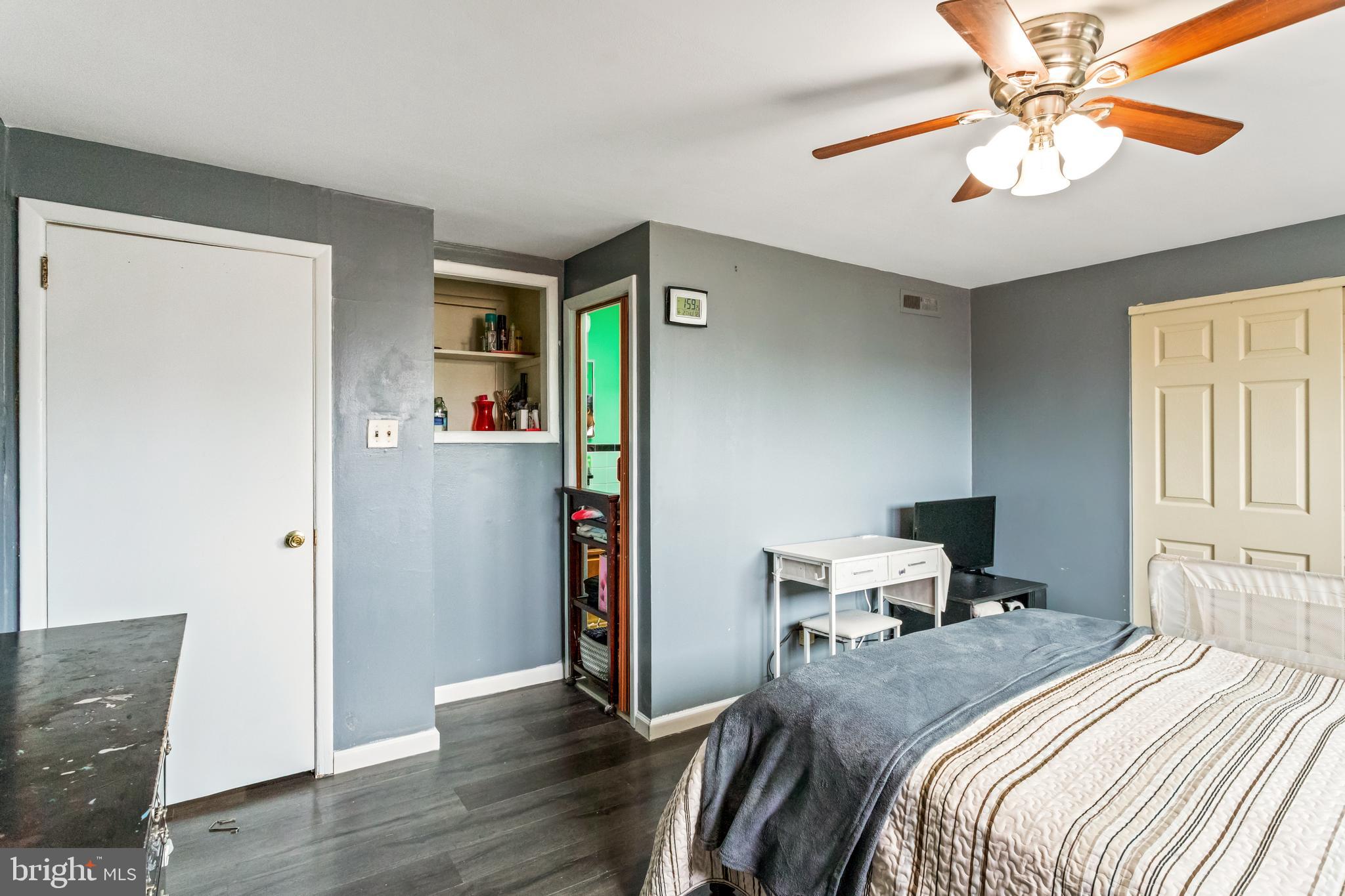 1043 Foster Street Philadelphia, PA 19116 - Photo 17 of 22 a bed room with a bed and a chandelier