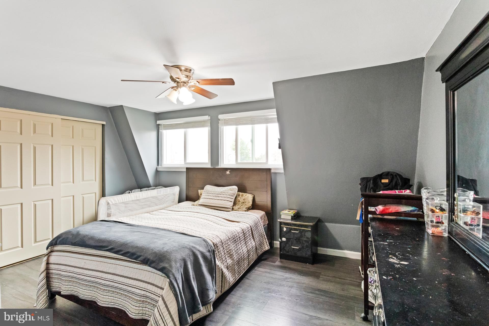 1043 Foster Street Philadelphia, PA 19116 - Photo 19 of 22 a bedroom with a bed and a chandelier