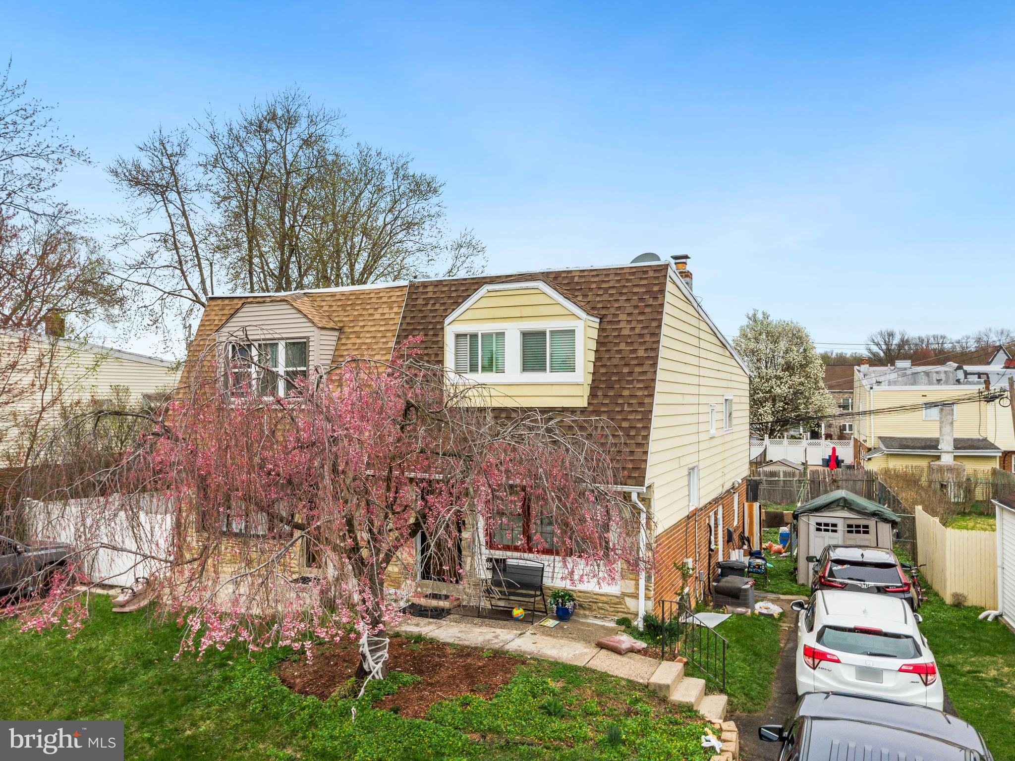 1043 Foster Street Philadelphia, PA 19116 - Photo 2 of 22 a front view of a house with a garden