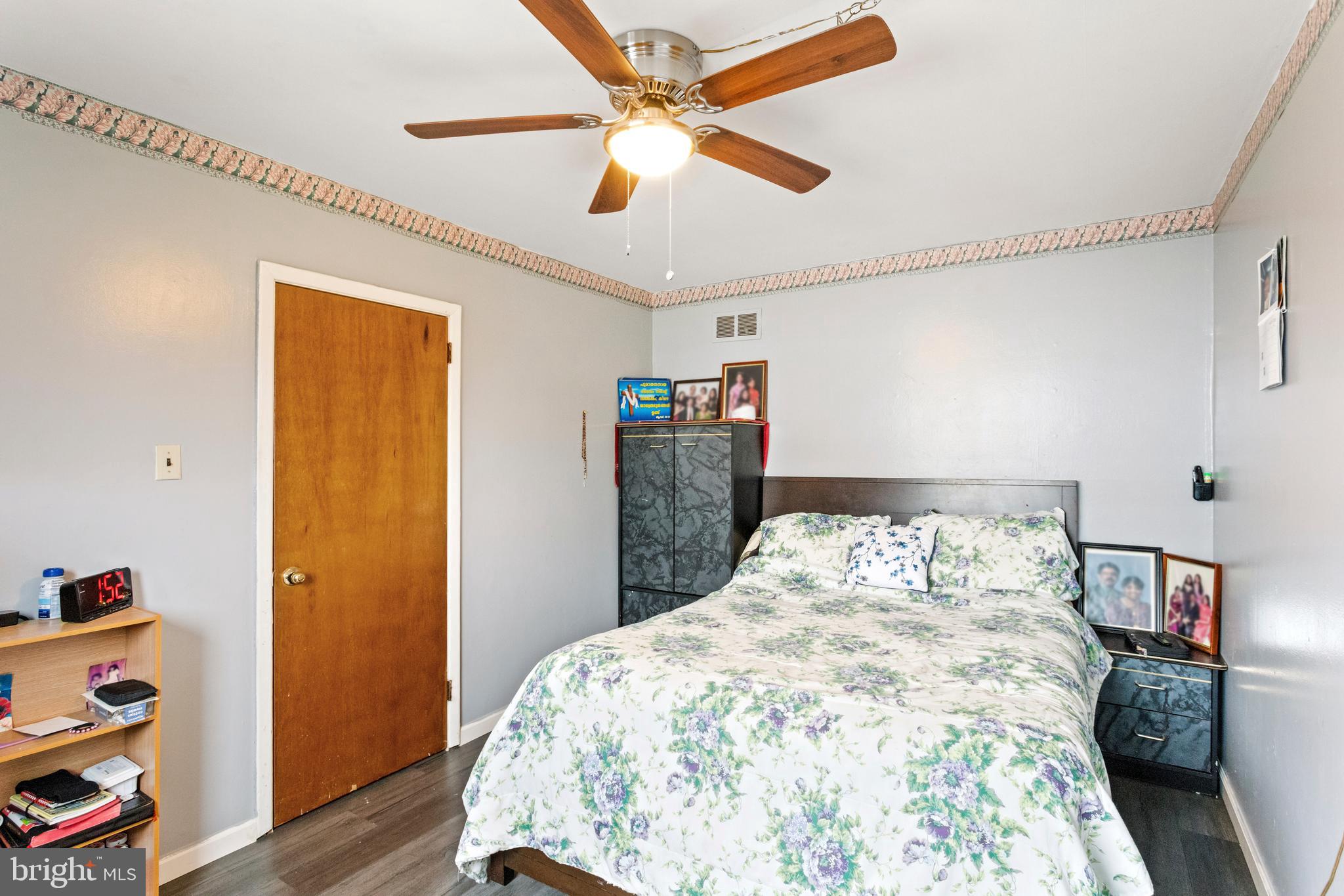 1043 Foster Street Philadelphia, PA 19116 - Photo 21 of 22 a bedroom with a bed and a bookshelf