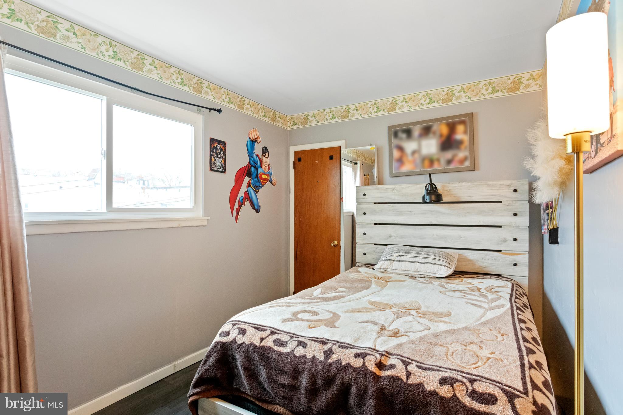 1043 Foster Street Philadelphia, PA 19116 - Photo 22 of 22 a bedroom with a bed and a window