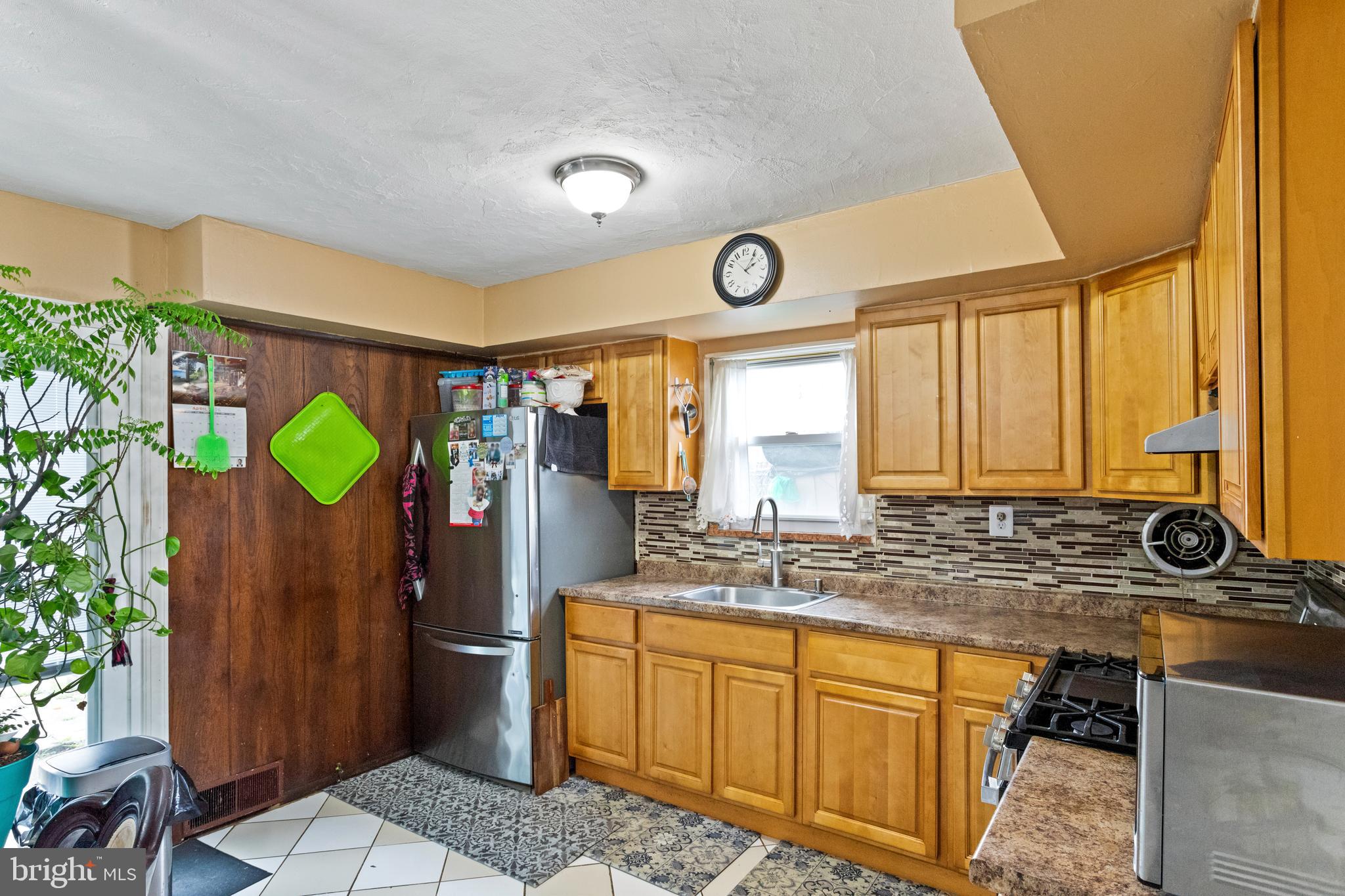 1043 Foster Street Philadelphia, PA 19116 - Photo 9 of 22 a bathroom with a granite countertop sink and a mirror