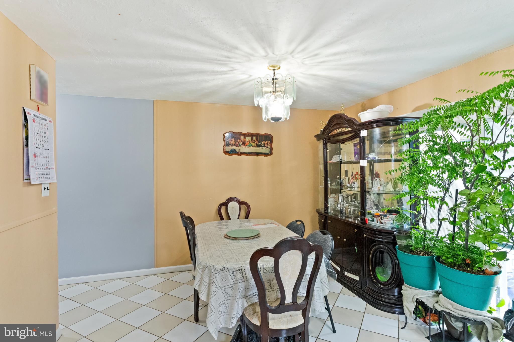 1043 Foster Street Philadelphia, PA 19116 - Photo 10 of 22 a view of a dining room with furniture and chandelier fan