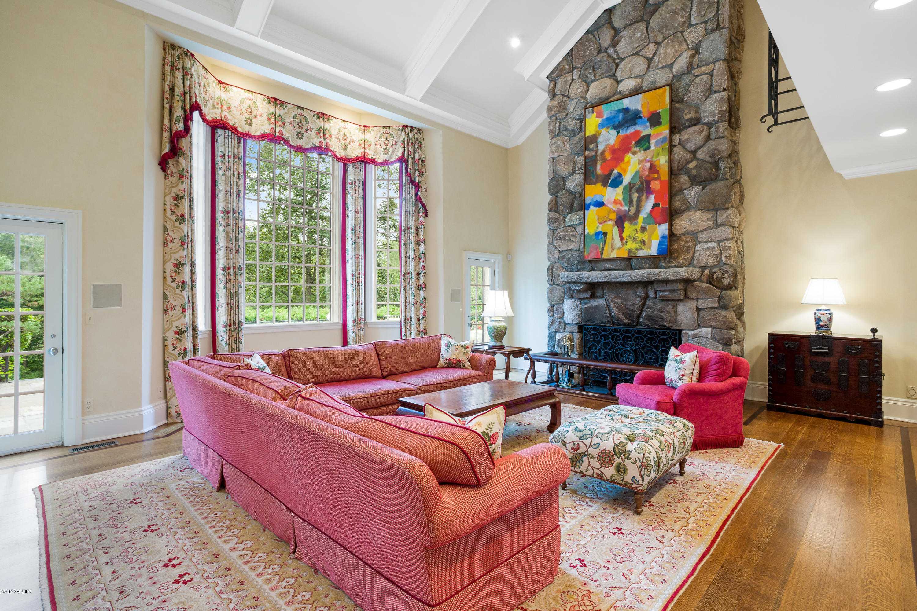 17 Cameron Drive Greenwich, CT 06831 - Photo 12 of 41 a living room with furniture a fireplace and a flat screen tv