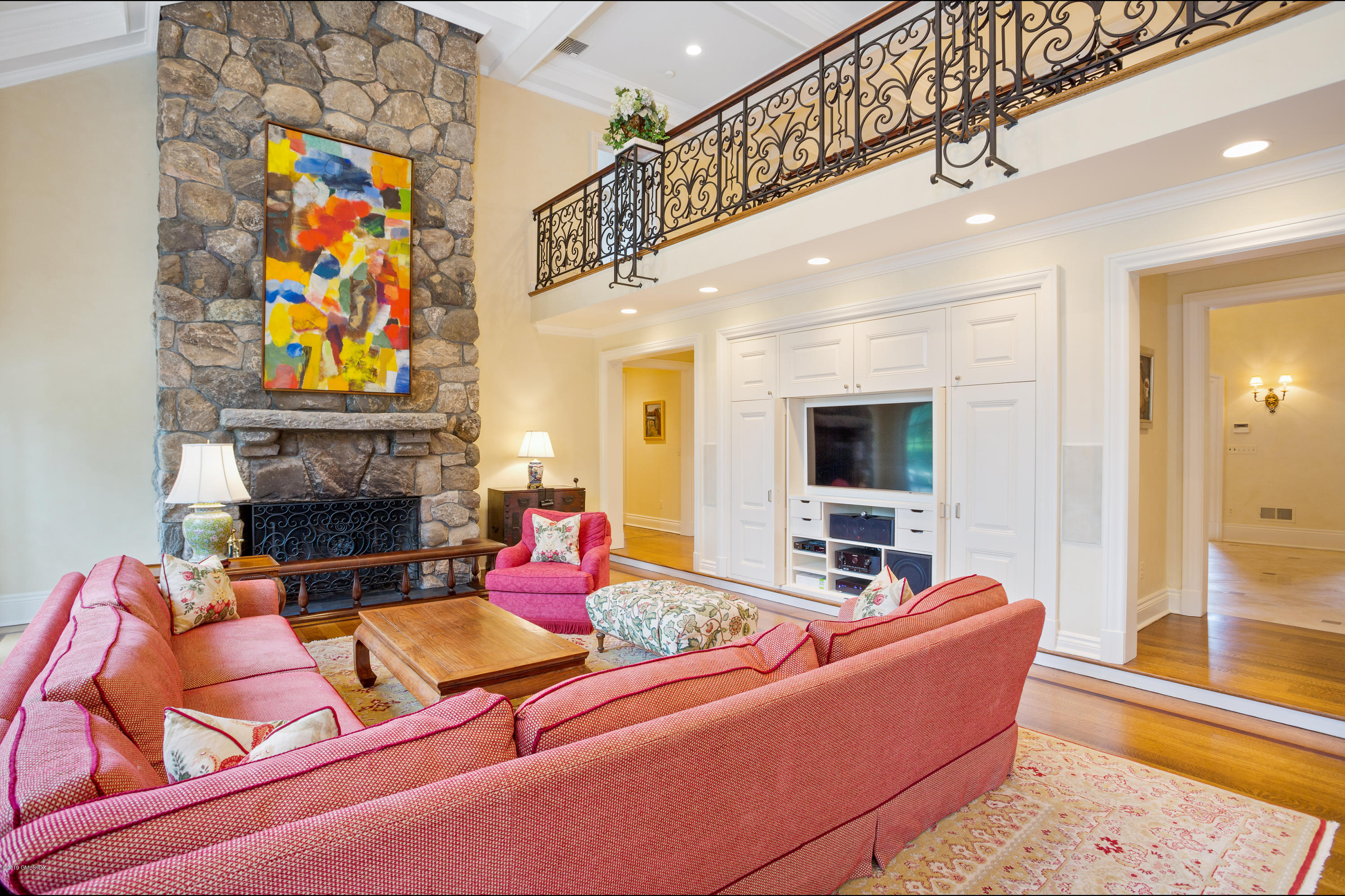 17 Cameron Drive Greenwich, CT 06831 - Photo 13 of 41 a living room with furniture fireplace and flat screen tv