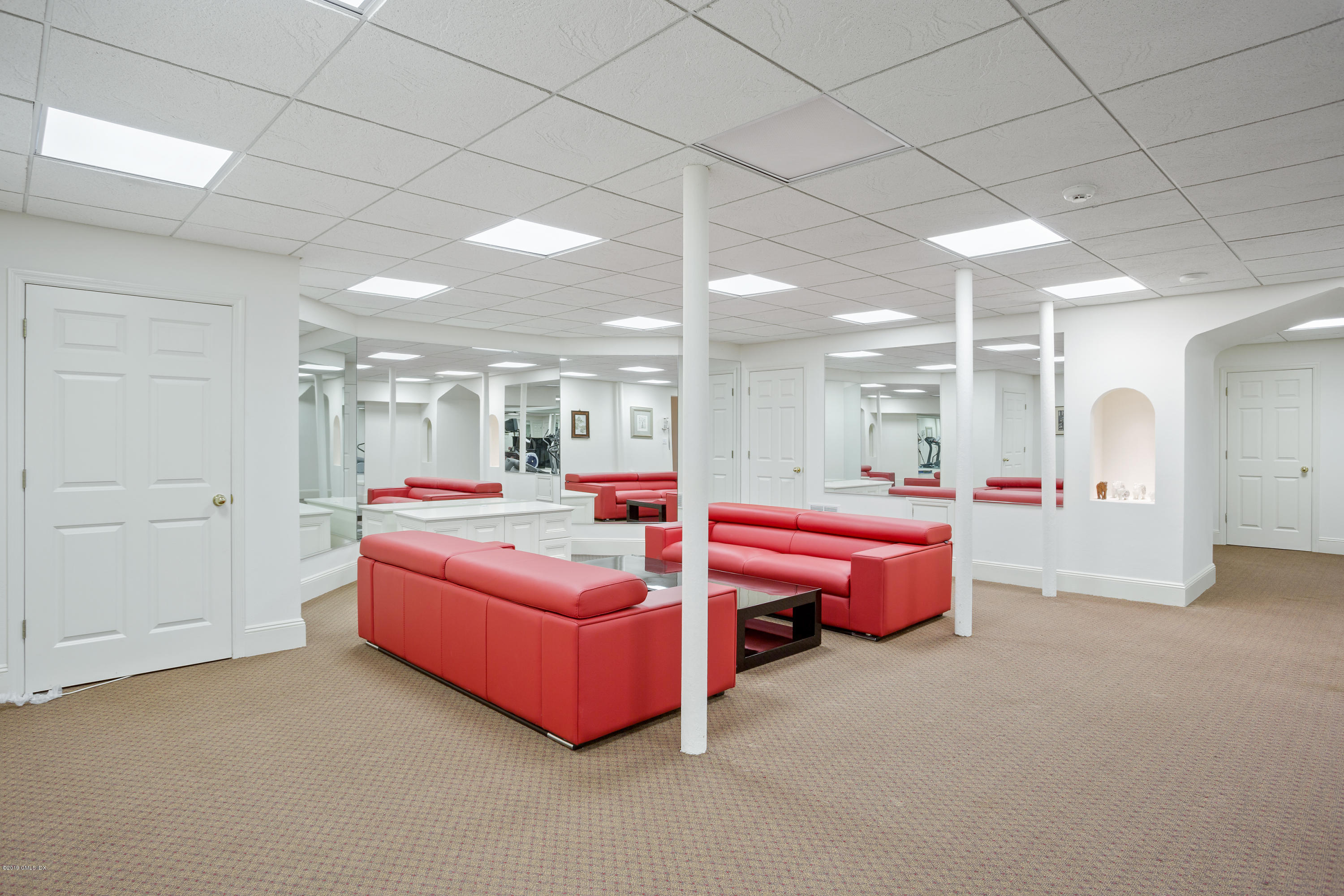 17 Cameron Drive Greenwich, CT 06831 - Photo 23 of 41 a spacious bedroom with a bed and a view of bathroom