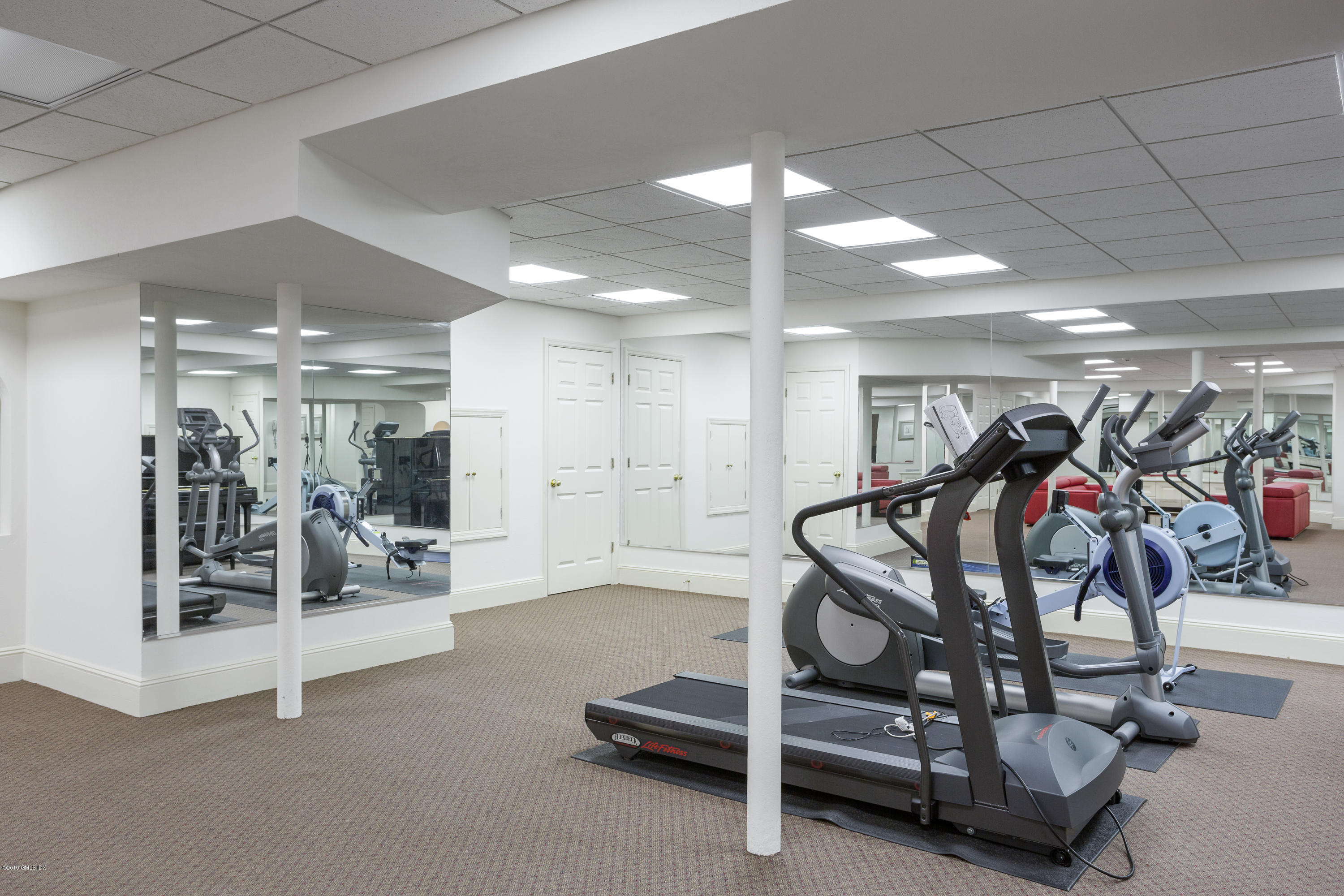 17 Cameron Drive Greenwich, CT 06831 - Photo 24 of 41 a view of a room with gym equipment