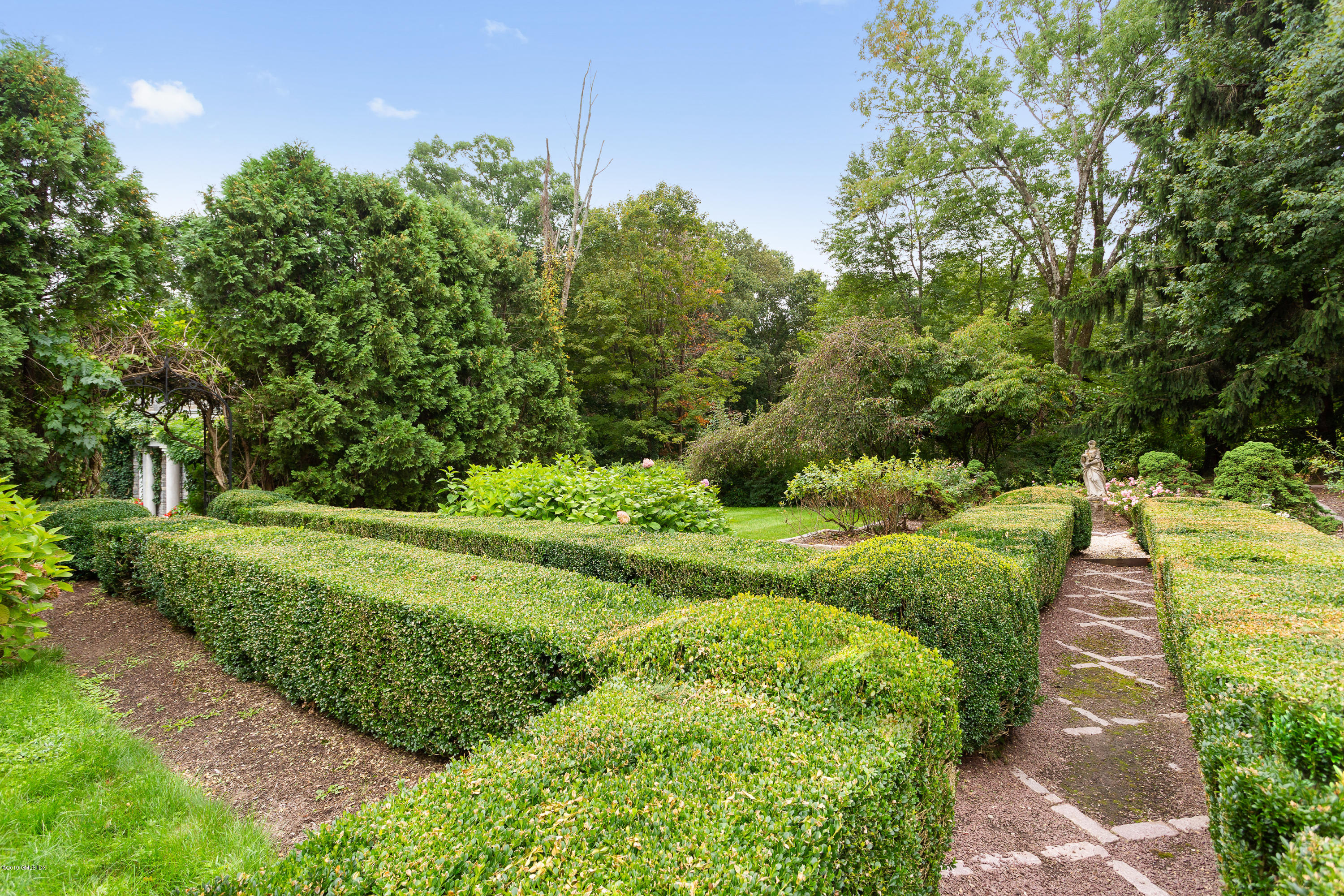 17 Cameron Drive Greenwich, CT 06831 - Photo 26 of 41 a view of a garden with large trees
