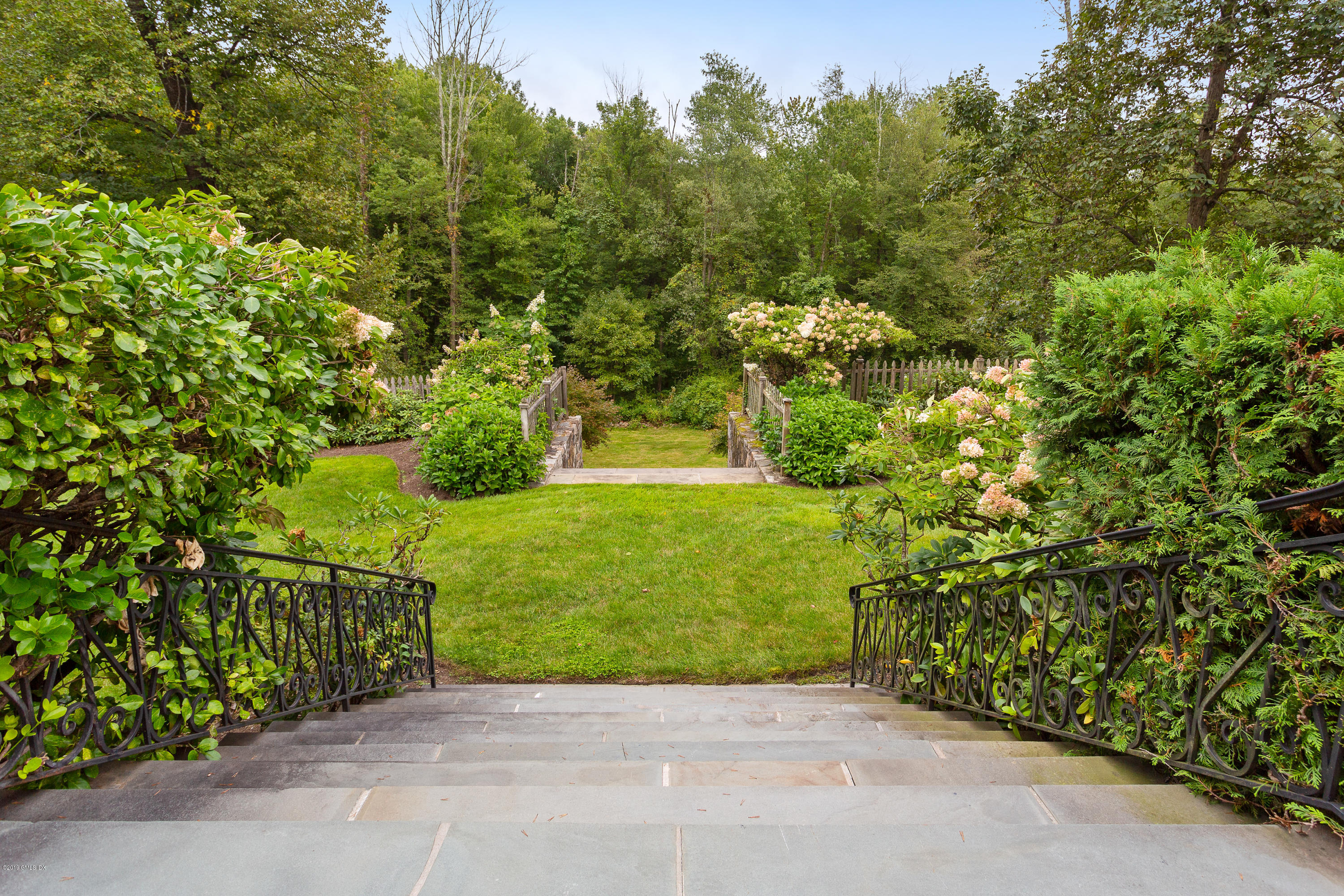 17 Cameron Drive Greenwich, CT 06831 - Photo 30 of 41 a view of a garden with pathway