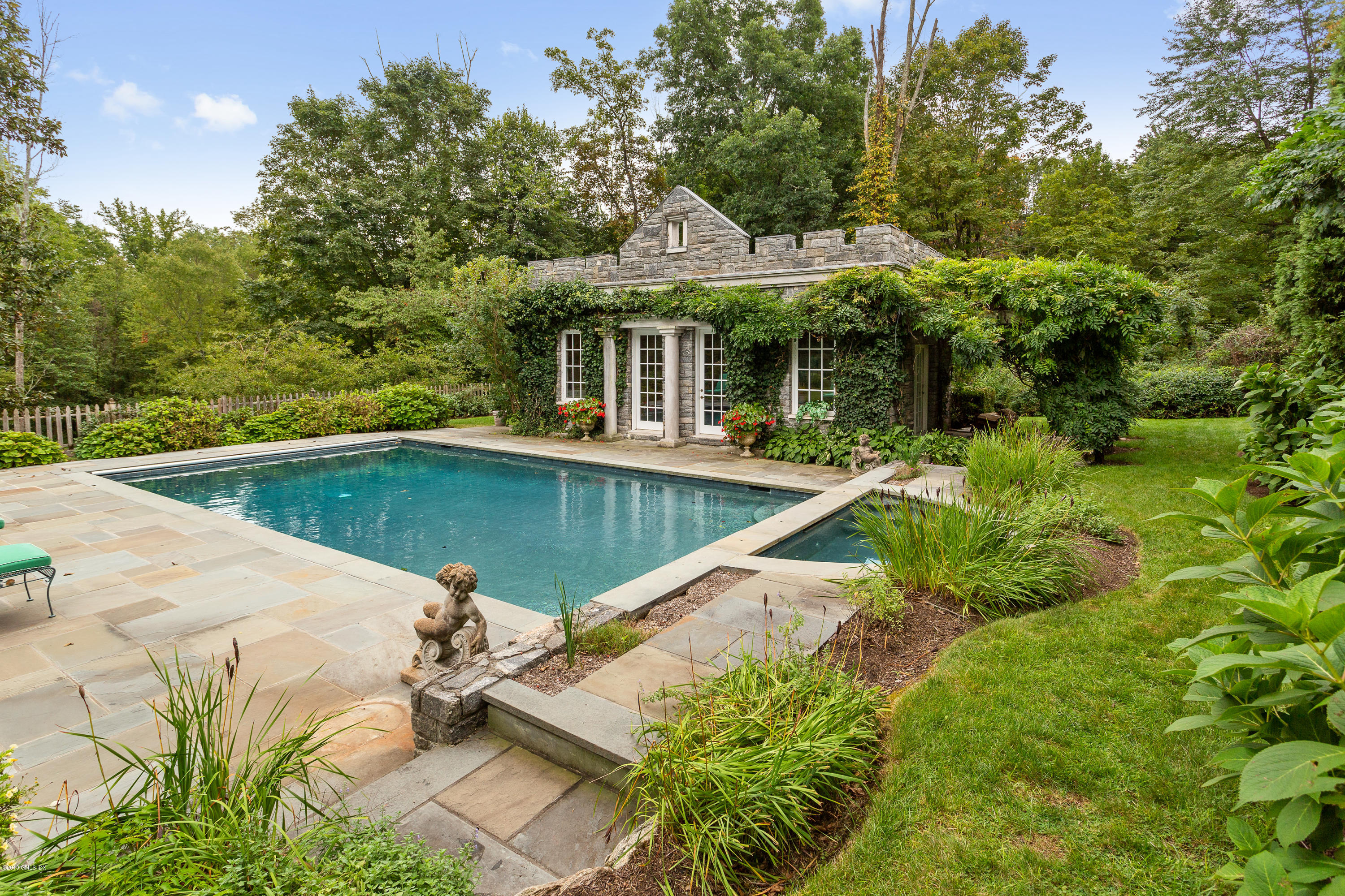 17 Cameron Drive Greenwich, CT 06831 - Photo 31 of 41 a view of a house with pool and sitting area